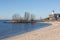 Beach of former island Urk with view at historic Lighthouse