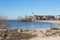 Beach of former island Urk with view at historic Lighthouse