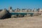 Beach front of Povoa de Varzim in Portugal, with breakwater of harbor in foreground.