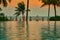 The beach front view with water pool ,umbrella and coconut tree