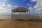 Beach gazebo overlooking the stormy sea