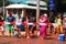 Beach goers await a train to pass