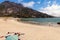 Beach goers enjoy the sunny beach of Ezaro in the Galicia region of Spain.