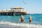 Beach-goers sunbathing on wooden dock swimming in the in summer in Antalya