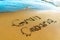 Beach. Gran Canaria is written on the sea sand