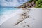 Beach Grand Anse on La Digue island, Seychelles. White sand and unique granite rock formation in background