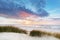 Beach grass on dune, Baltic sea at sunset