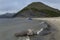 Beach of the great river and the catamaran under the mountain.