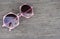 Beach holiday concept - close up pink cute women sunglasses on table