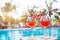 Beach holidays background with two cocktails near swimming pool in luxurious hotel