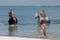 Beach Horseback Riders with Little Girl