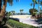 Beach with hot sand, good weather and lots of sun loungers and parasols.