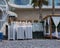 The beach at the hotel at the end of the day, Folded umbrellas and stacks of sun loungers.