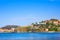 Beach hotels in Collioure village with a windmill at the top of the hill, Roussillon, Vermilion coast, Pyrenees Orientales, France