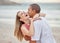 Beach, hug and happy couple celebrate love, dating and marriage at sea, ocean water or luxury vacation travel. Man and