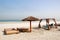 Beach with hut and sunbeds of the luxury hotel