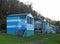 Beach huts chalets sheds in a row by the coast