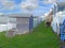 Beach huts chalets sheds in a row by the coast