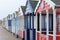 Beach huts coloured doors on wooden huts England