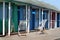 Beach huts and deck Chairs.