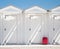 Beach huts and red suitcase