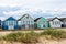 Beach huts on sandy dunes on English coast