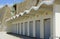 Beach huts under cliff near Brighton. Sussex. England