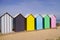 Beach huts wooden bathing boxes on sandy beach