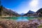 Beach lake Jasna with mountains Razor and Prisojnik in Slovenia