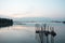 Beach landscape view with wooden foot bridge during sunset. Beatiful screnery of a beach with ocean and sky and water reflection