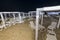 Beach and lido at night with umbrellas and deck chairs