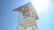 Beach lifeguard tower in bonfire lighting, approaching zoom