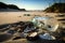 beach littered with broken glass and plastic bottles, a testament to careless waste disposal