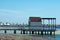 The beach at Lo Pagan on the Mar Menor in Spain.  With a view of a wooden jetty.