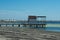 The beach at Lo Pagan on the Mar Menor in Spain.  A wooden jetty at the seaside.