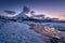 Beach on the Lofoten islands, Norway. Mountains, beach and clouds during sunset. Evening time. Winter landscape near the ocean.