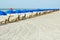 Beach lounge chairs with umbrellas