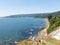 Beach lovers facing the Pacific Ocean from the fort of Niebla village. Estuary and mouth of the Valdivia River. Valdivia, Los Rios