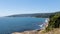 Beach lovers facing the Pacific Ocean from the fort of Niebla village. Estuary and mouth of the Valdivia River. Valdivia, Los Rios