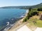 Beach lovers facing the Pacific Ocean from the fort of Niebla village. Estuary and mouth of the Valdivia River. Valdivia, Los Rios