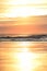 The beach is at low tide at dawn with a magnificent variety of colors in the sky.