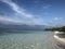 Beach Maldives sandy white crystal clear sky blue shades green lagoon reef waves