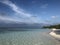 Beach Maldives sandy white crystal clear sky blue shades green lagoon reef waves