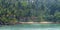 The beach with many plam trees in Koh Rong, Cambodia