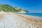 The beach of Mezzavalle unique bay in Conero natural park dramatic coast headland rock cliff adriatic sea Italy turquoise