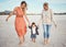 Beach, mother and grandma with boy holding hands having fun, bonding and walking. Family, care and grandmother, mom and