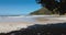 Beach with mountains and ocean with waves in Florianopolis