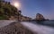 A beach at night with the moonlight