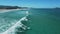 Beach and ocean with waves in Brazil. Aerial view of Campeche beach, Florianopolis