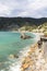 Beach over Mediterranean Sea, single rock in  turquoise color water, Cinque Terre, Monterosso, Italy